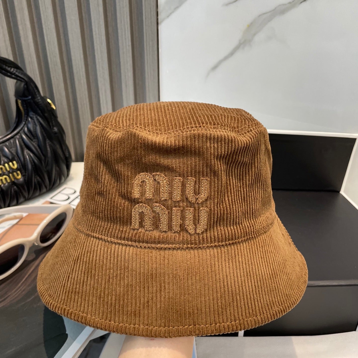 MM BUCKET IN BURNT ORANGE VELVET WITH LOGO