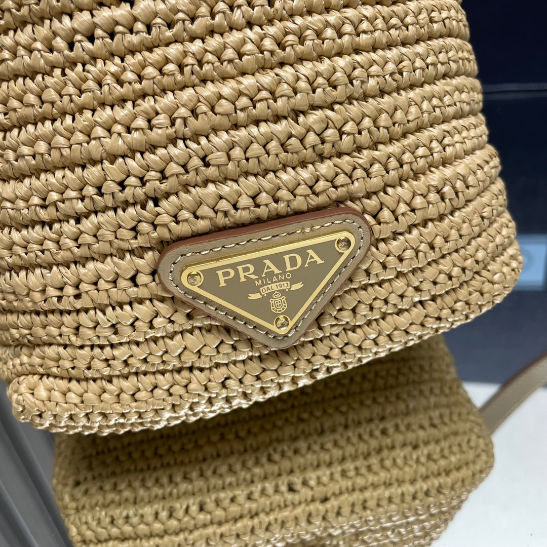 PRADA BUCKET BAG 20 IN BEIGE WOVEN RAFFIA EMBOSSED LOGO