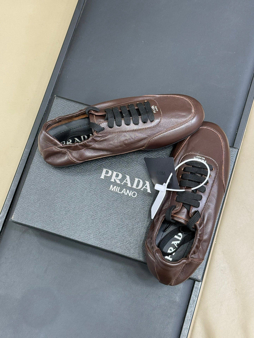 PRADA 25S COLLAPSE FLAT SHOES IN RK BROWN CALFSKIN