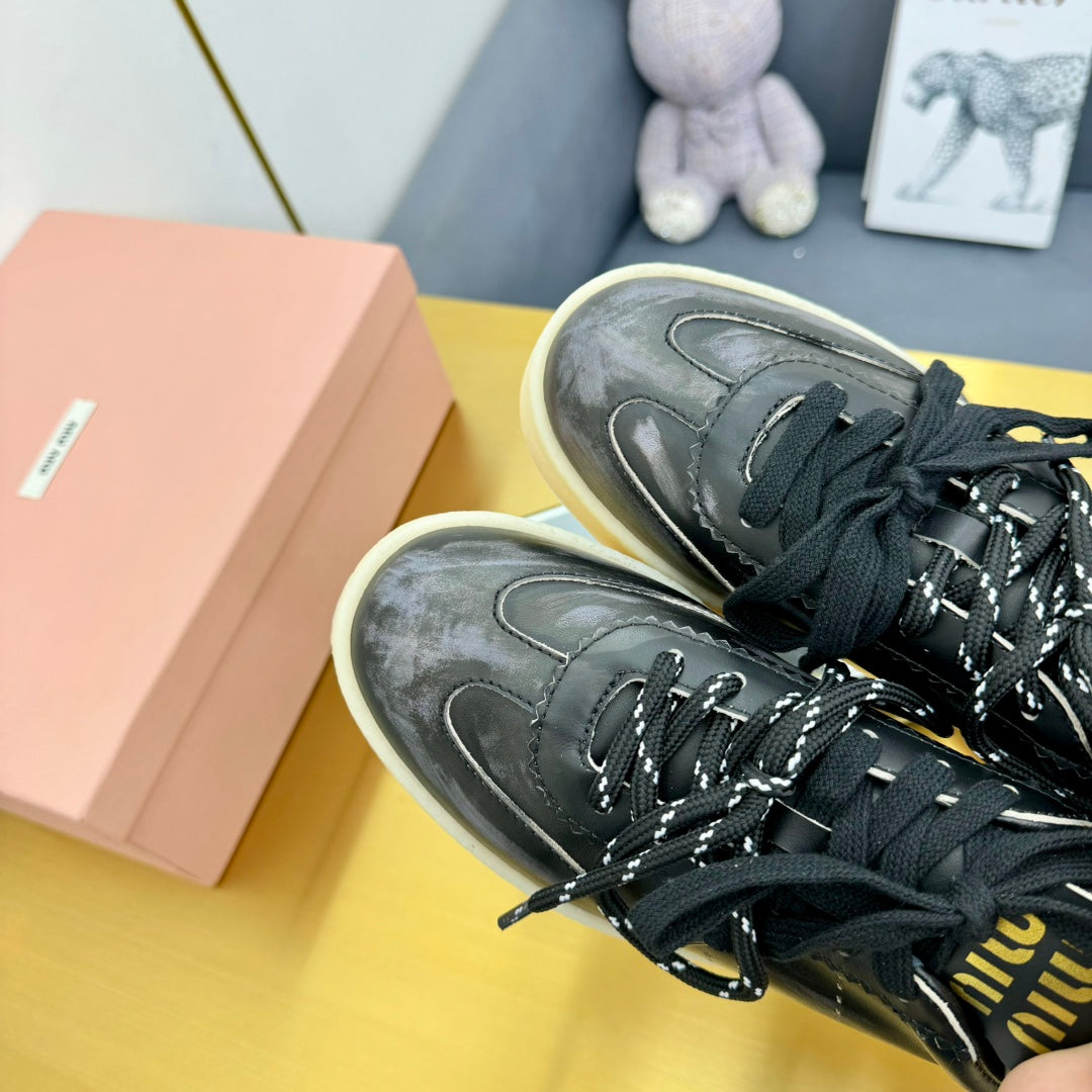 MIU MIU THICK-SOLED RETRO SNEAKERS IN BLACK DUST LAMBSKIN