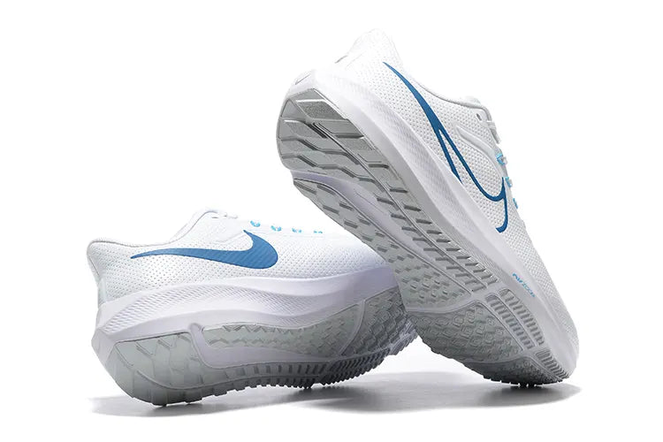 Nike Pegasus 40 White Blue Running shoes with grey outsole on white background